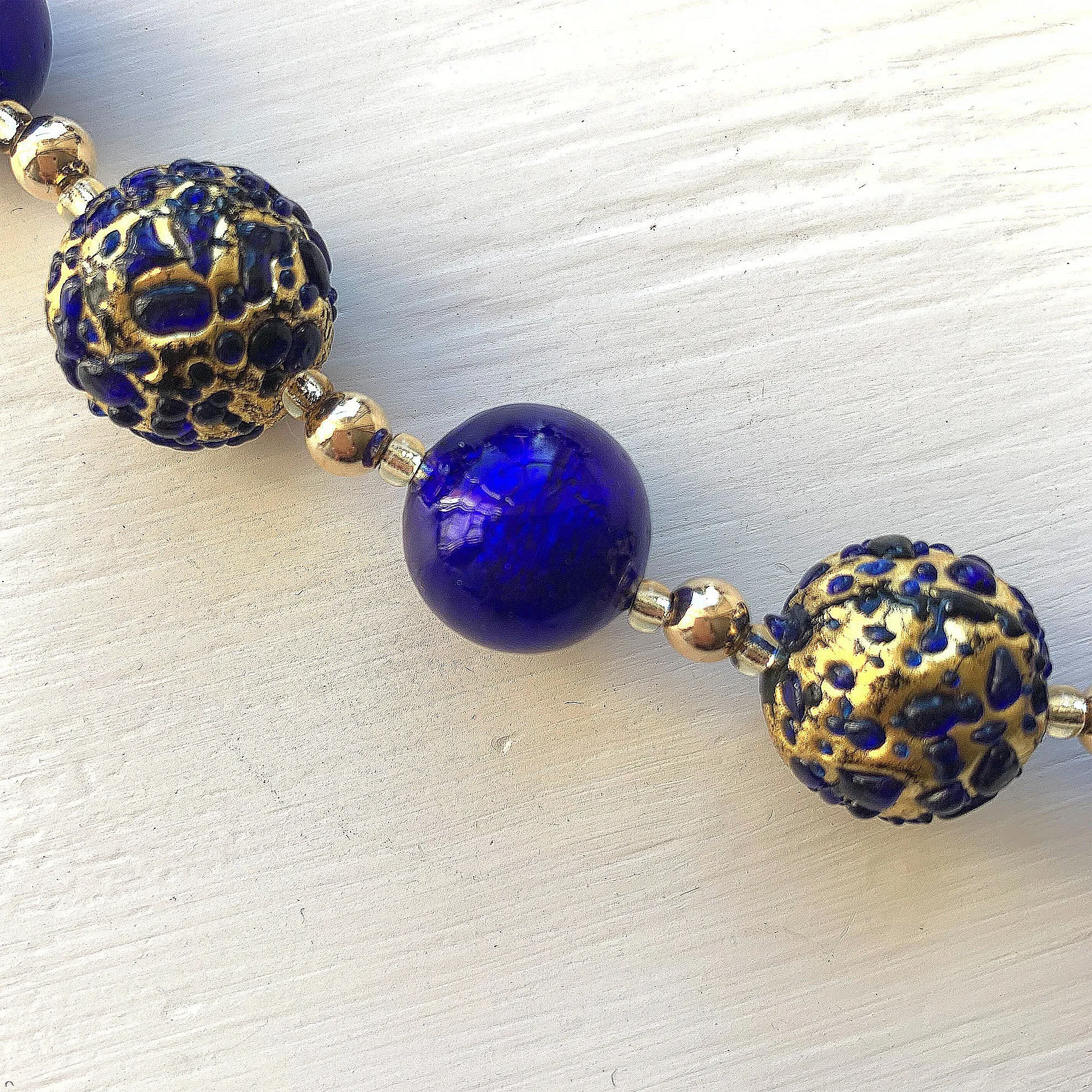 Necklace with dark blue (cobalt) and dark blue Murano glass sphere beads on gold